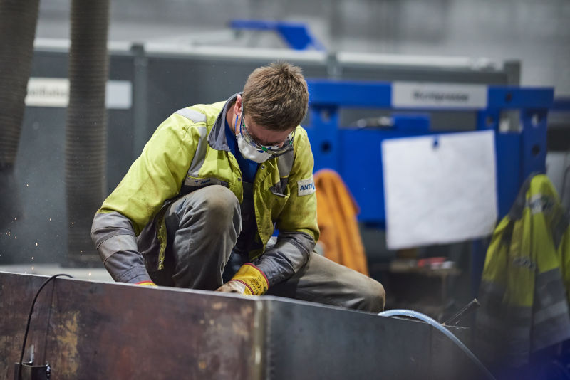 Antrok employee smiles into the camera